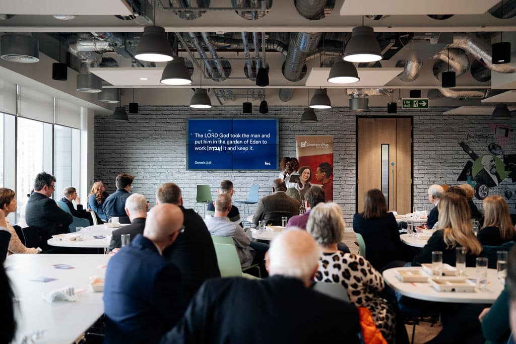 ChaplaincyPlus Annual Review Celebration 2024. A group listening to the main speaker of the event.