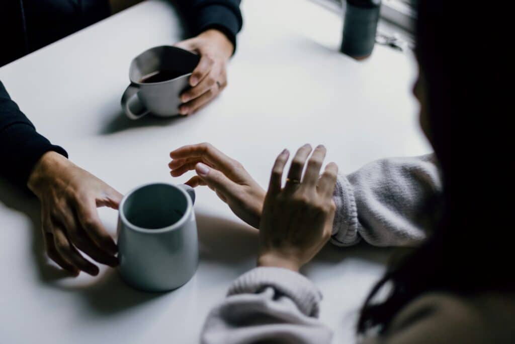 Two friends meet over coffee