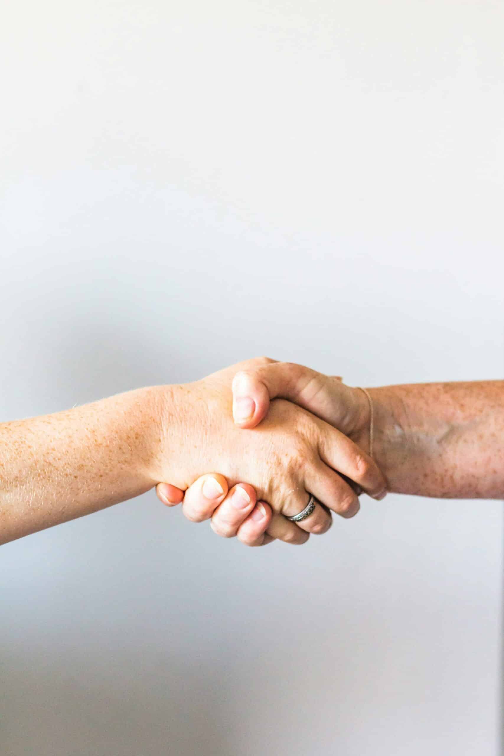 A handshake showing resolved conflict