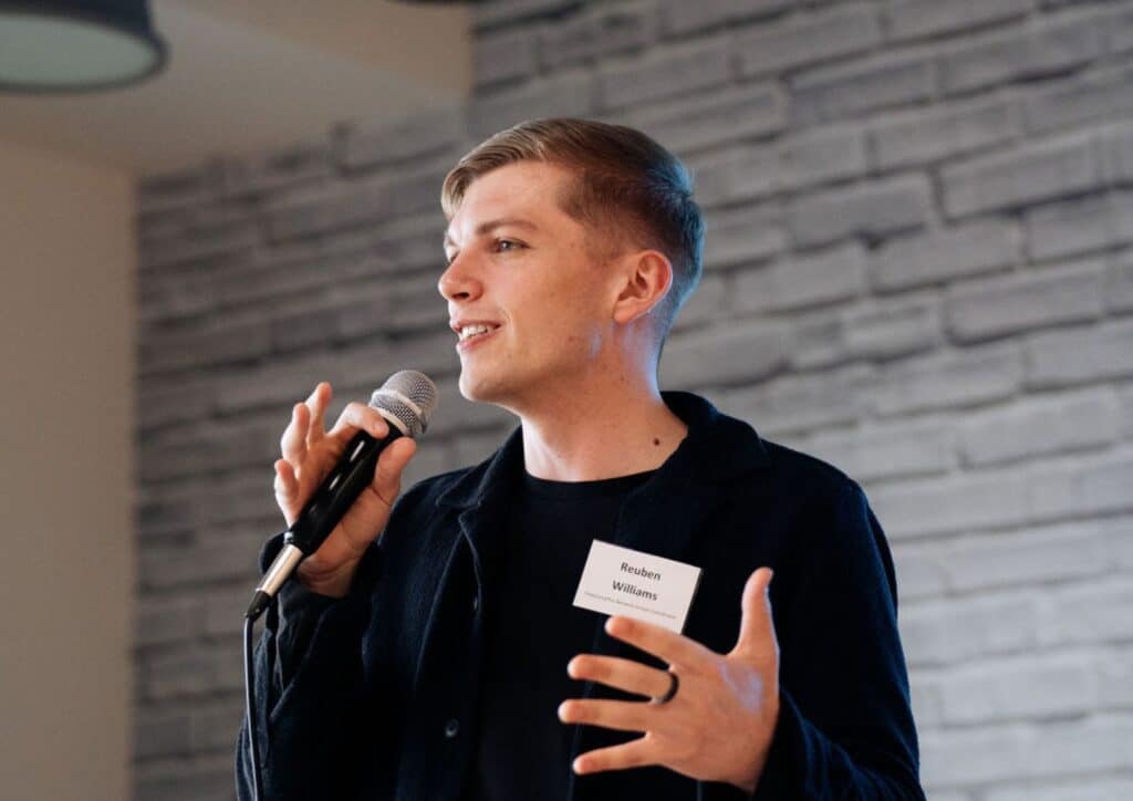 Young man talking into a microphone